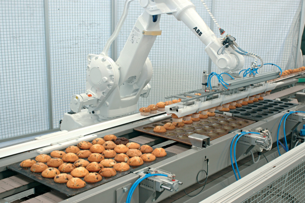 Industrial robots operating on a beverage production line β a key part of smart automation in F&B manufacturing.